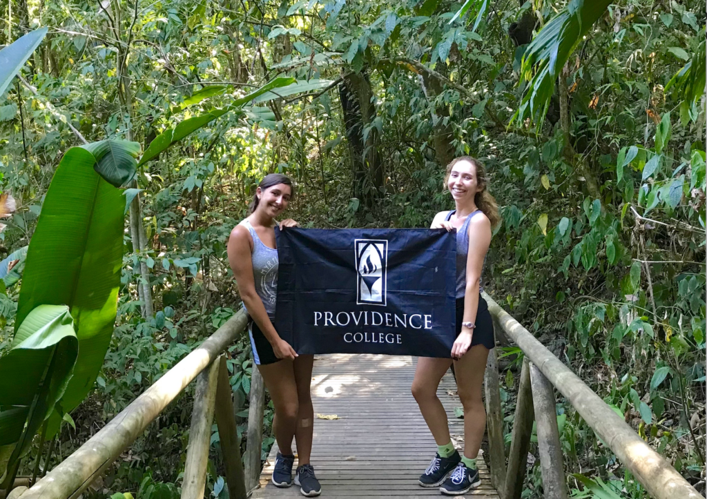 students holding a PC banner